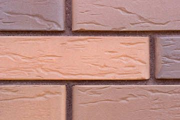 Background of orange and violet grungy brick wall texture