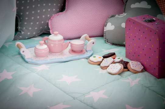 Children's bedroom interior with tea set and toys