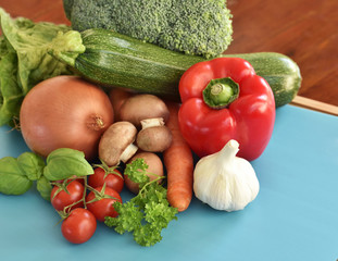 Fresh vegetables and fresh fruit on a wooden tablet. Healthy eating background with copy space. High angle view.