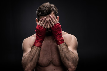 Fototapeta na wymiar Boxer with wrapping hands