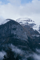 Mountain. Top view in the snow with fog, Italian Alps
