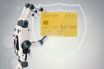 robot hand holding credit card