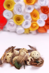 Obraz na płótnie Canvas Easter composition with festive flowers decoration and traditional treats mini eggs