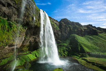 Famous waterfall Seljalandsfoss in the summer, Iceland.