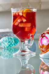 Hot mulled wine in a glass cup