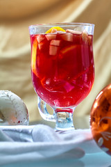 Hot mulled wine in a glass cup