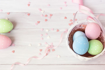 Easter eggs decoration - painted eggs on wooden background