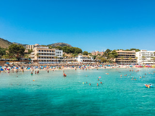 Fototapeta premium beach at paguera with people in the water