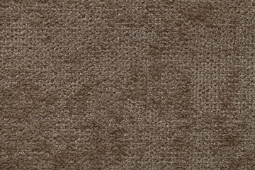 Brown background of soft, fleecy cloth. Texture of textile closeup