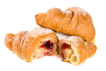 croissant and half with cherry jam powdered sugar isolated on white background closeup