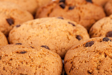 Oatmeal cookies with chocolate close-up as a background