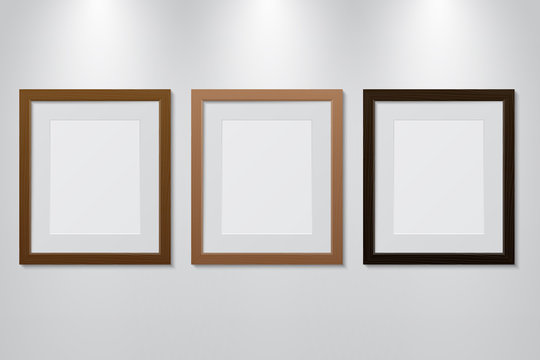 Empty wooden picture frames set on the wall with light effect, vector illustration