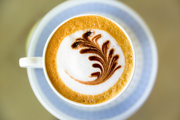 Cup of cappuccino in coffee shop  