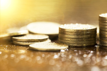 Golden coins closeup - money savings concept