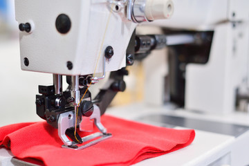 sewing machine. Equipment garment factory. The concept of the textile industry.