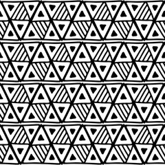 Seamless vector pattern. Black and white geometrical background with hand drawn decorative tribal elements. Print with ethnic, folk, traditional motifs. Graphic vector illustration.