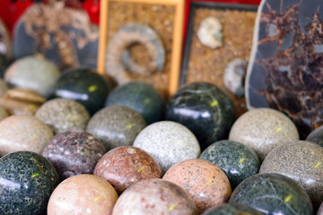 stone balls of different minerals, ammonites, tourist souvenir