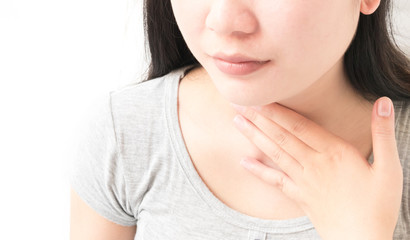 Closeup woman throat pain with sick on white background, health care and medical conecpt