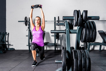 Fototapeta na wymiar Sportswoman exercising in gym