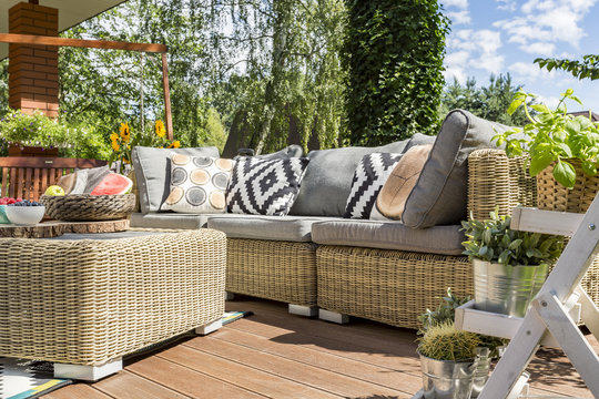 Modern garden patio with rattan sofa