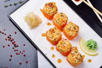 baked rolls, traditional Japanese cuisine. dark background