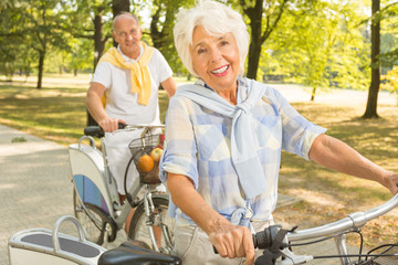 Senior woman cycling in park