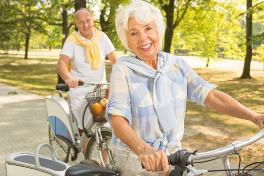 Senior woman cycling in park