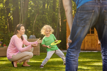 Boy in garden with parents