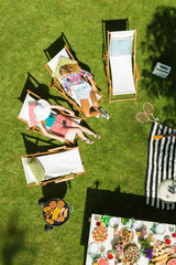 Women lying on deckchairs