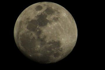 A big gray moon with a lot of craters.