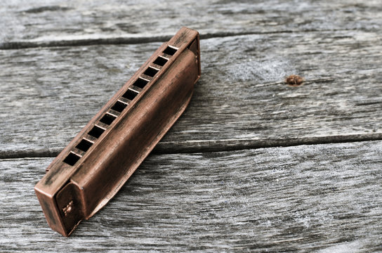 Harmonica on a wooden table