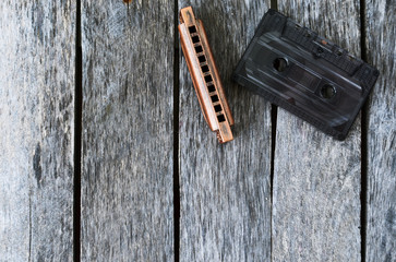 Harmonica and an old audio cassette tape