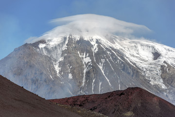 The cone of the Ostry Tolbachik volcano on the background of blue sky - Kamchatka, Russia