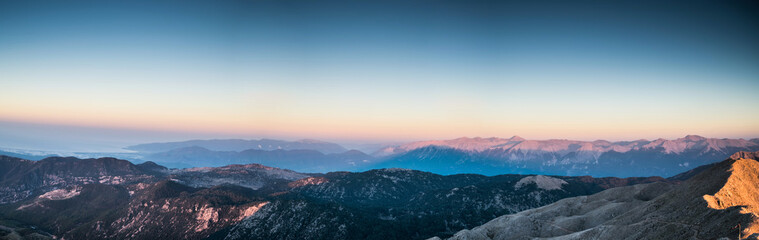 view from the top of Tahtali Mountain Range during sunrise on sea and valley, Turkey, Kemer