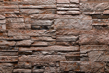 Brown Stone wall texture background natural color