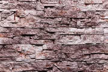 Red brown Stone wall texture background natural color