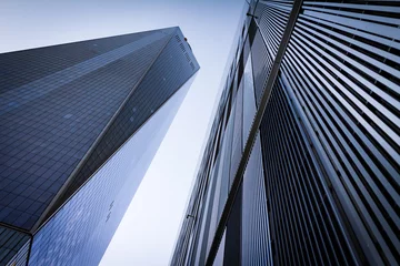 Photo sur Plexiglas construction de la ville Gratte-ciel sur fond de ciel clair à New York City