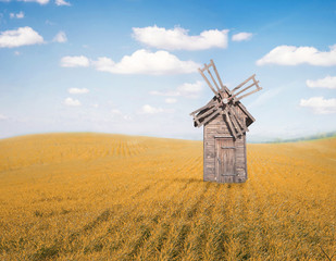 Windmill in field