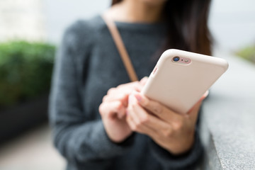 Woman working on mobile phone