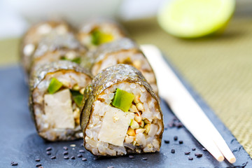 Vegan homemade vegan sushi rolls with tofu and avocado. Love for a healthy vegan food concept