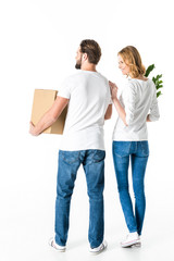 Fototapeta na wymiar Couple holding box and plant