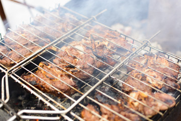 Meat on a grill with smoke