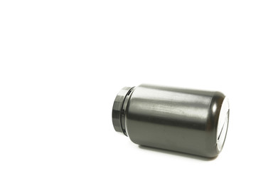 A black plastic bottle on the white background. No brand plastic empty bottle