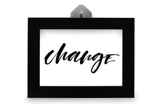 Change. Inspirational quote, handwritten text. Modern calligraphy. Black wooden frame. Close-up