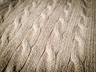 Close-up photo of knitted crumpled textured surface background