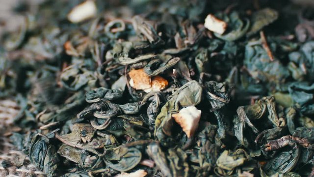 Green tea leaves close up rotation