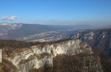 cliff with rock and forest in the mountains in winter