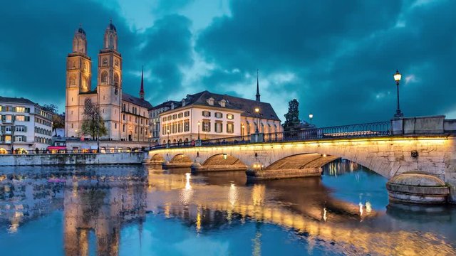 Munsterbrucke and Grossmunster church reflecting in river Limmat, Zurich, Switzerland (static image with animated sky)
