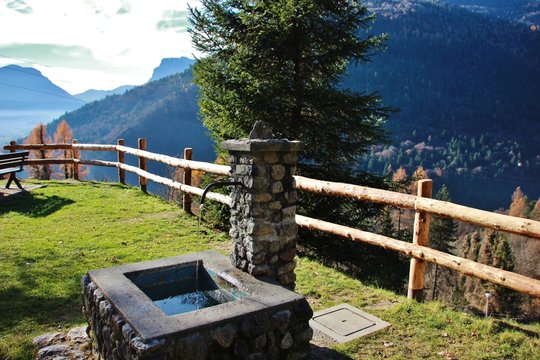 Old fountain in Stenico, Trentino, Italy