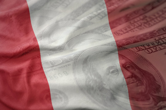 colorful waving national flag of peru on a american dollar money background. finance concept
